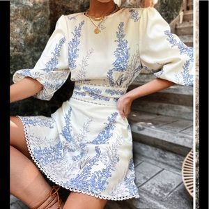 Sz L Top and skirt attached at center waist. Puffy sleeves and waist ties Nwt